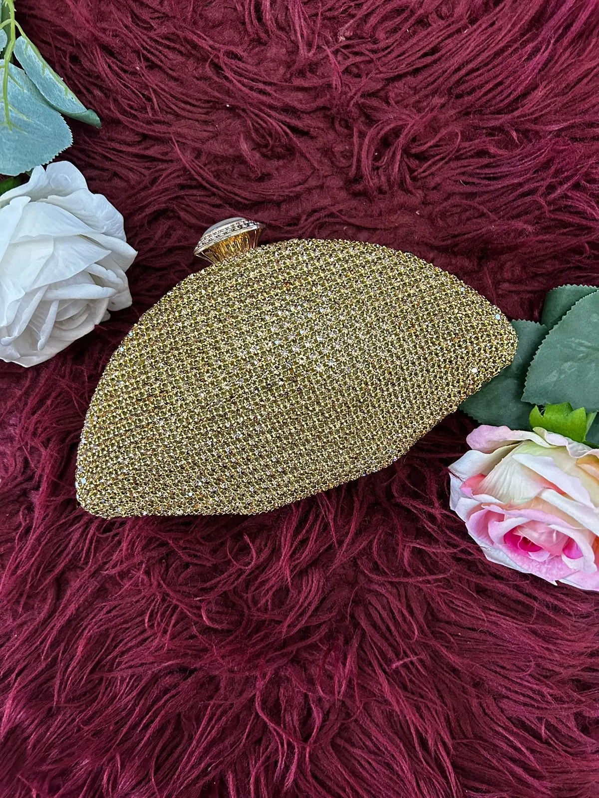 Oval shaped clutch bag